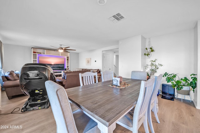 dining room featuring ceiling fan and light wood-type flooring