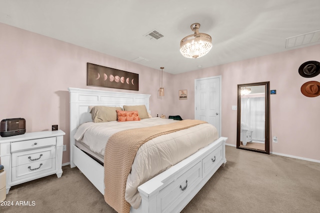 bedroom with light colored carpet