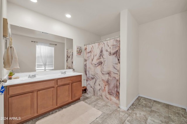 bathroom with vanity and a shower with shower curtain