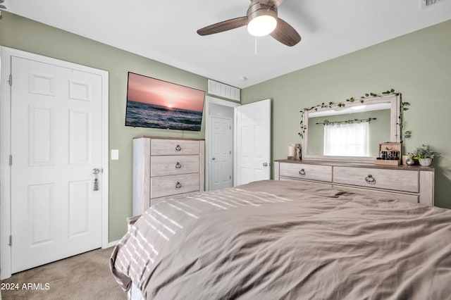 carpeted bedroom with ceiling fan