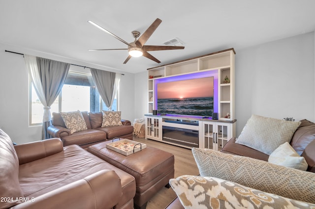 living room with ceiling fan and light hardwood / wood-style flooring