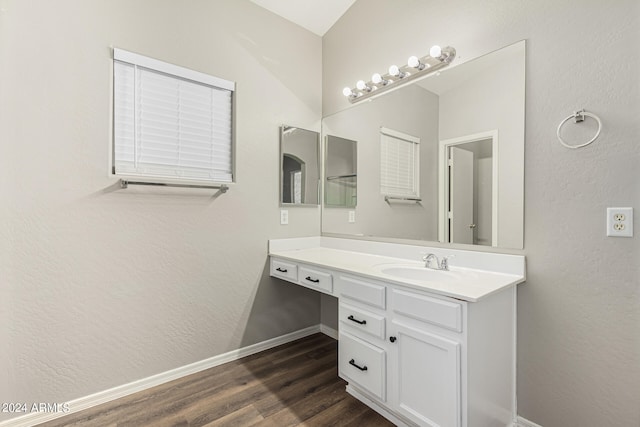 bathroom featuring vanity and hardwood / wood-style floors