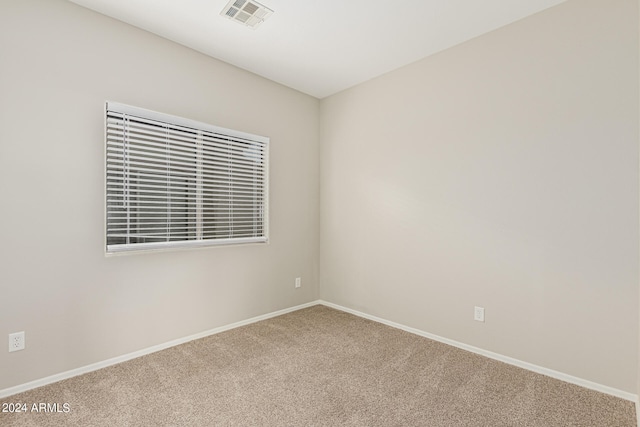 unfurnished room featuring carpet flooring