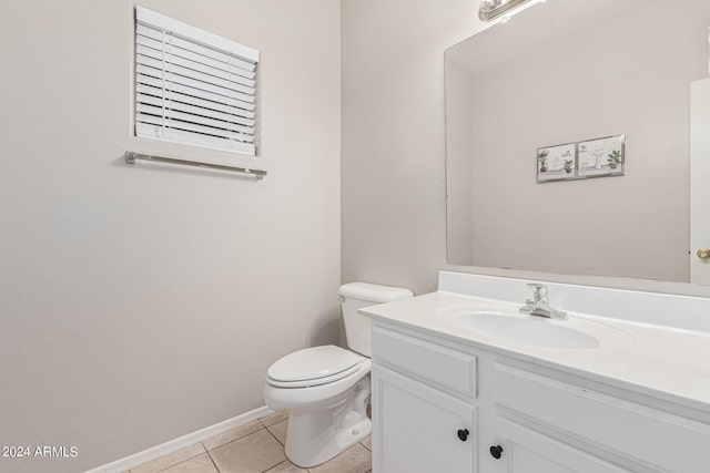 bathroom featuring vanity, toilet, and tile patterned floors