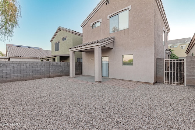 rear view of house with a patio