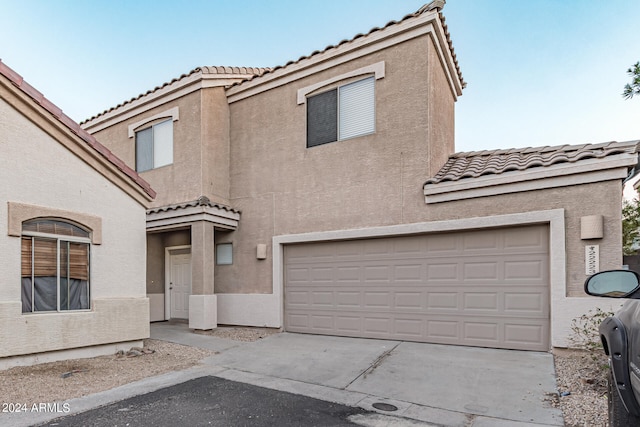 view of front of property with a garage