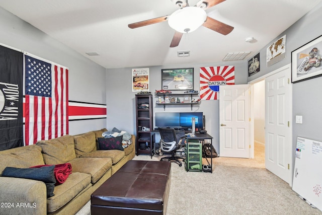 carpeted living room with ceiling fan