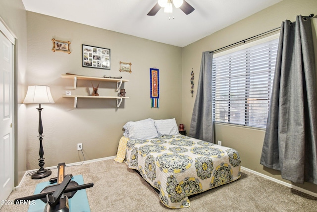 bedroom with ceiling fan and carpet floors