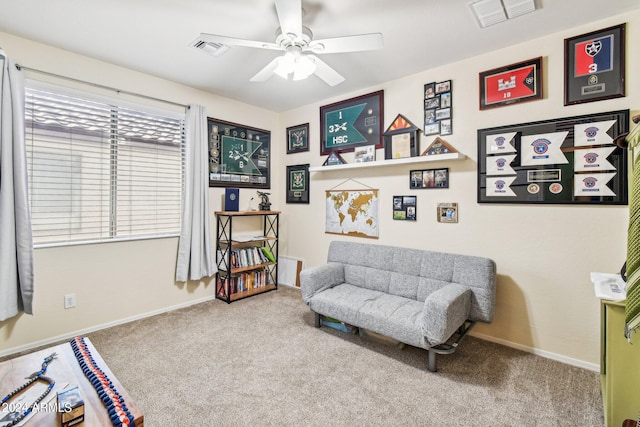 sitting room featuring carpet floors and ceiling fan