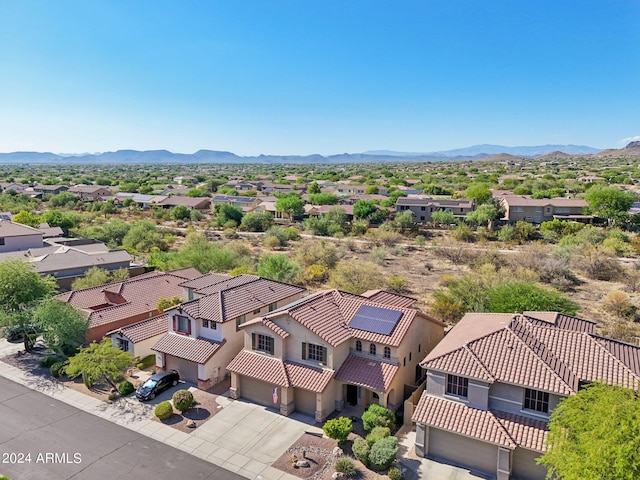 birds eye view of property featuring a mountain view