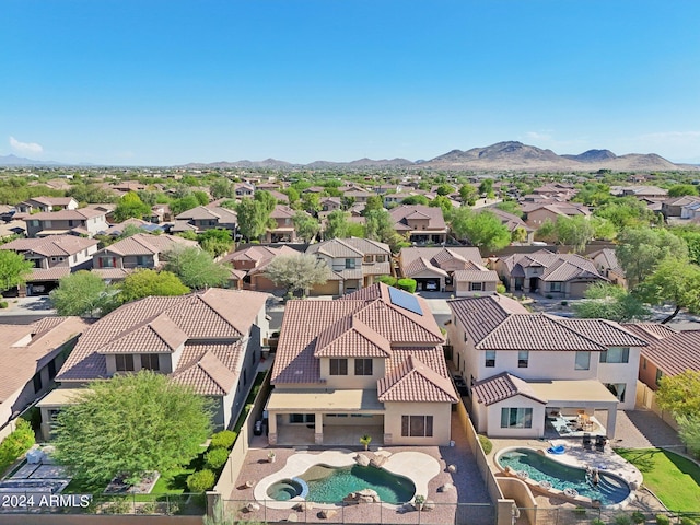 birds eye view of property featuring a mountain view