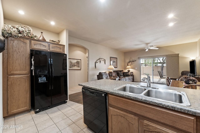 kitchen with light tile patterned flooring, ceiling fan, sink, and black appliances