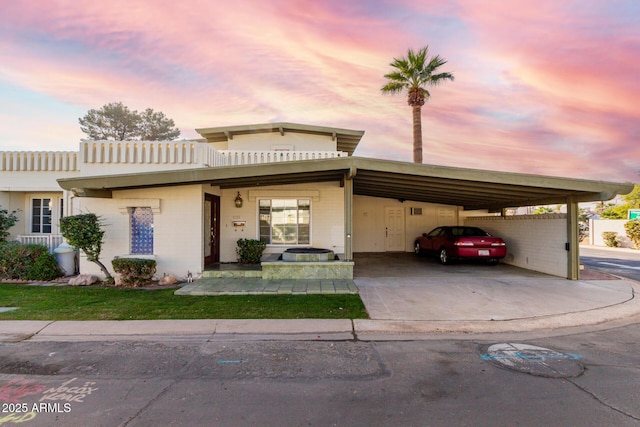 view of front of property featuring a carport