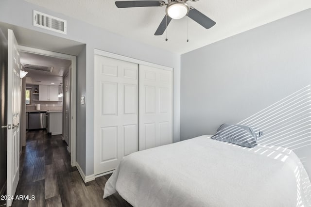 bedroom with a closet, dark wood-type flooring, and ceiling fan