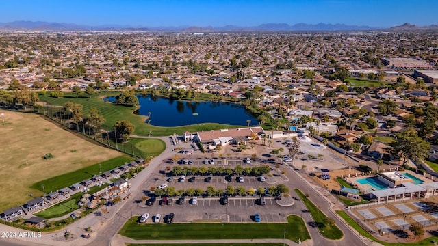 drone / aerial view with a water and mountain view