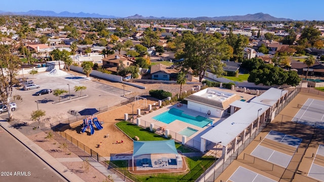 birds eye view of property with a mountain view