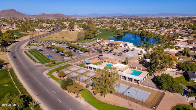 bird's eye view with a water and mountain view