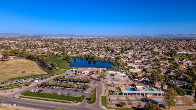 birds eye view of property featuring a water and mountain view