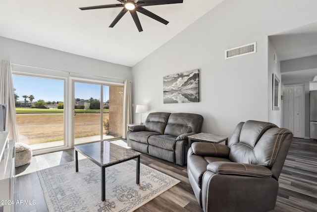 living room with ceiling fan, dark hardwood / wood-style flooring, and high vaulted ceiling