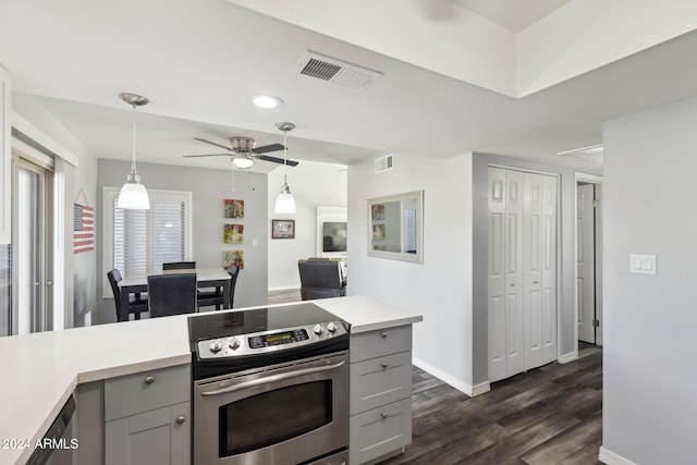 kitchen with gray cabinetry, ceiling fan, dark wood-type flooring, decorative light fixtures, and stainless steel range with electric cooktop