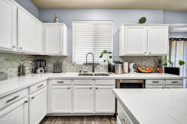 kitchen featuring white cabinets, wine cooler, sink, tasteful backsplash, and dark hardwood / wood-style flooring