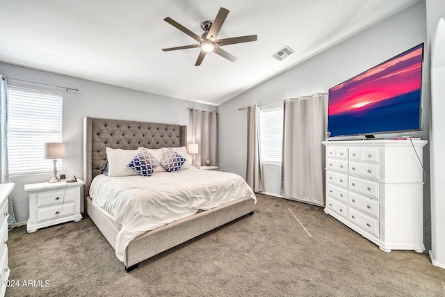 bedroom featuring vaulted ceiling, ceiling fan, and dark carpet