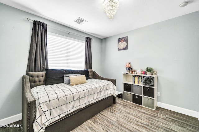 bedroom featuring wood-type flooring