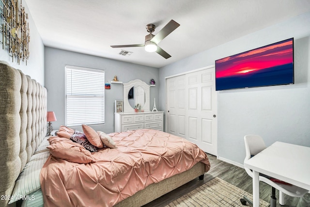 bedroom with a closet, ceiling fan, and hardwood / wood-style flooring