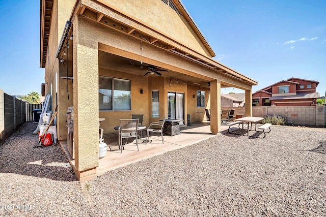 rear view of house with a patio and ceiling fan