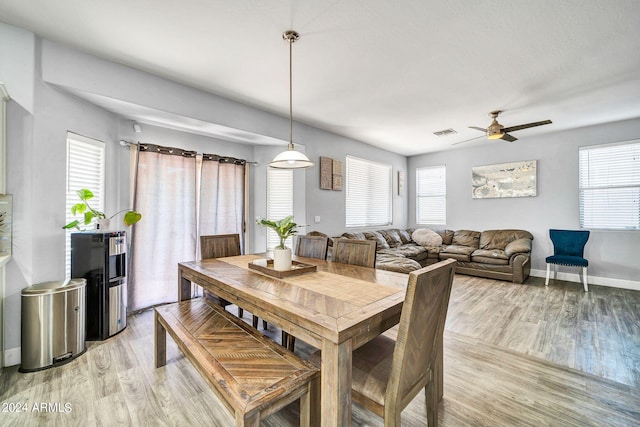 dining area featuring ceiling fan and light hardwood / wood-style flooring