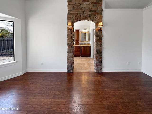 unfurnished room with dark wood-type flooring