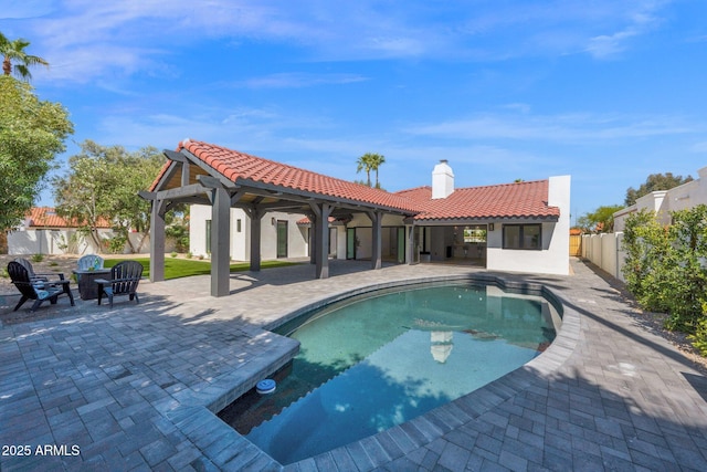 view of pool featuring an outdoor fire pit, a patio, a fenced backyard, and a fenced in pool