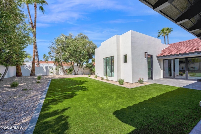 view of yard with a fenced backyard and a patio