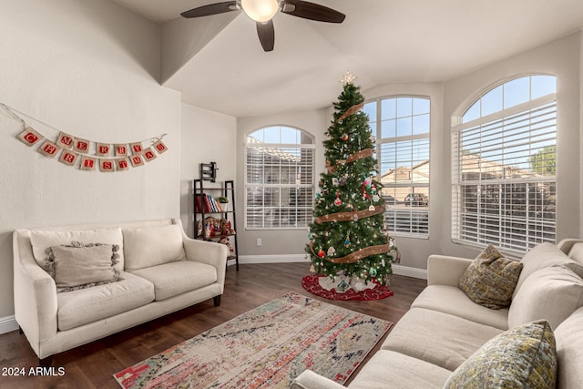 living room featuring ceiling fan and dark hardwood / wood-style flooring