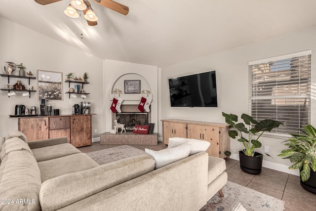 tiled living room featuring ceiling fan