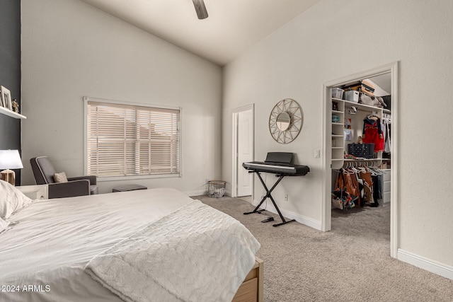 bedroom with a spacious closet, ceiling fan, high vaulted ceiling, light colored carpet, and a closet