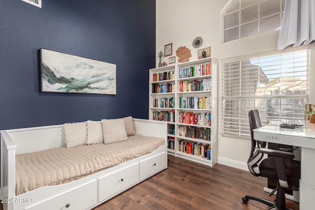 home office with dark hardwood / wood-style floors