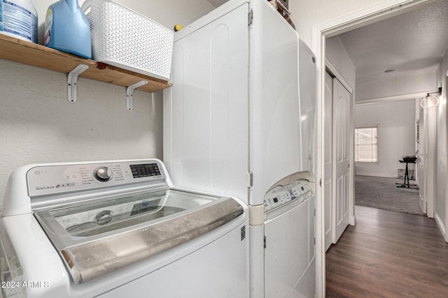 clothes washing area with dark carpet