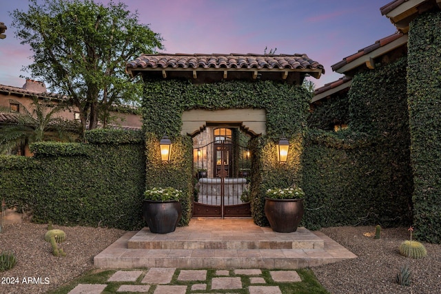 view of patio terrace at dusk