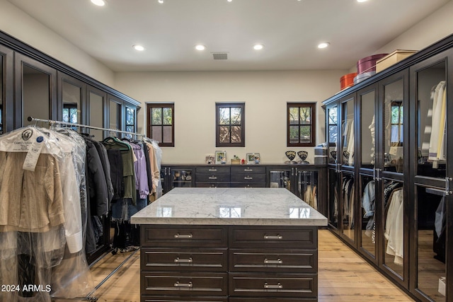 walk in closet featuring light wood-type flooring