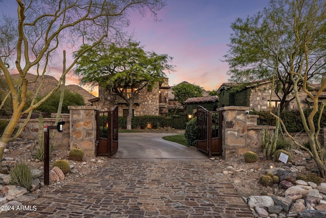 view of gate at dusk