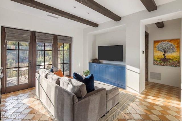 living room featuring beamed ceiling, french doors, and light tile floors