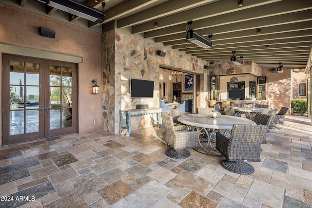 view of terrace with french doors and ceiling fan