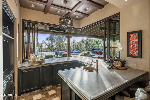 office with coffered ceiling, beamed ceiling, and sink