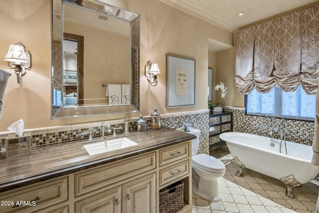 bathroom featuring tile walls, tasteful backsplash, vanity, and toilet