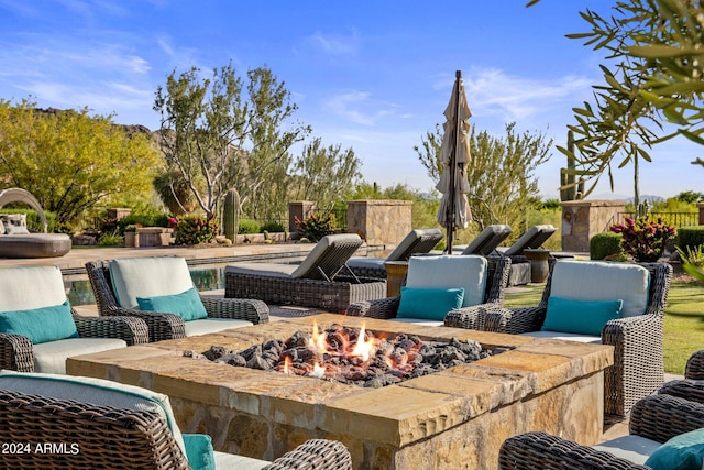 view of patio / terrace featuring an outdoor fire pit