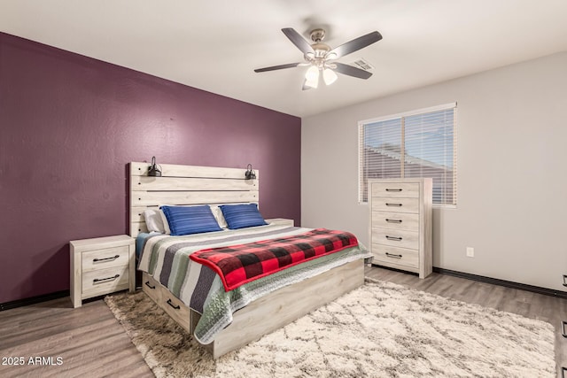 18008 W Tina Ln, Surprise, AZ 85387 - bedroom with wood finished floors, a ceiling fan, and baseboards