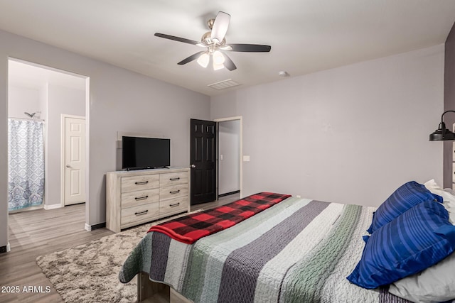 18008 W Tina Ln, Surprise, AZ 85387 - bedroom with light wood finished floors, ceiling fan, and baseboards