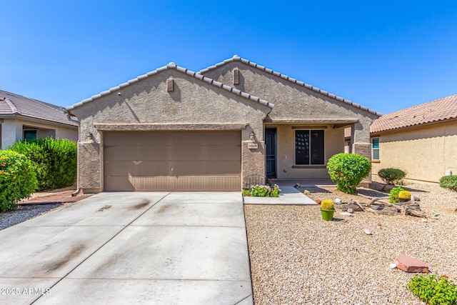 18008 W Tina Ln, Surprise, AZ 85387 - ranch-style house featuring a garage, stucco siding, driveway, and a tile roof