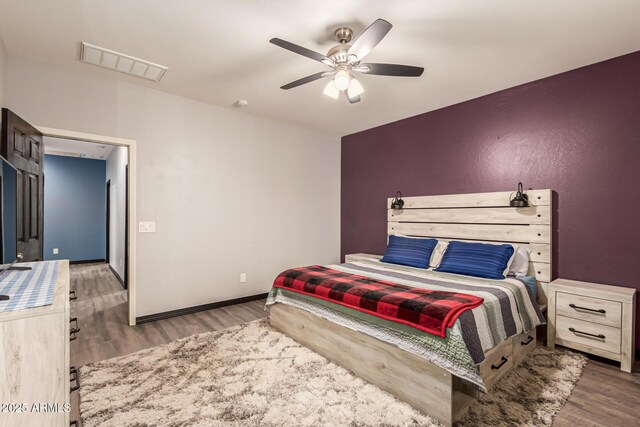 18008 W Tina Ln, Surprise, AZ 85387 - bedroom featuring wood finished floors, ceiling fan, and baseboards